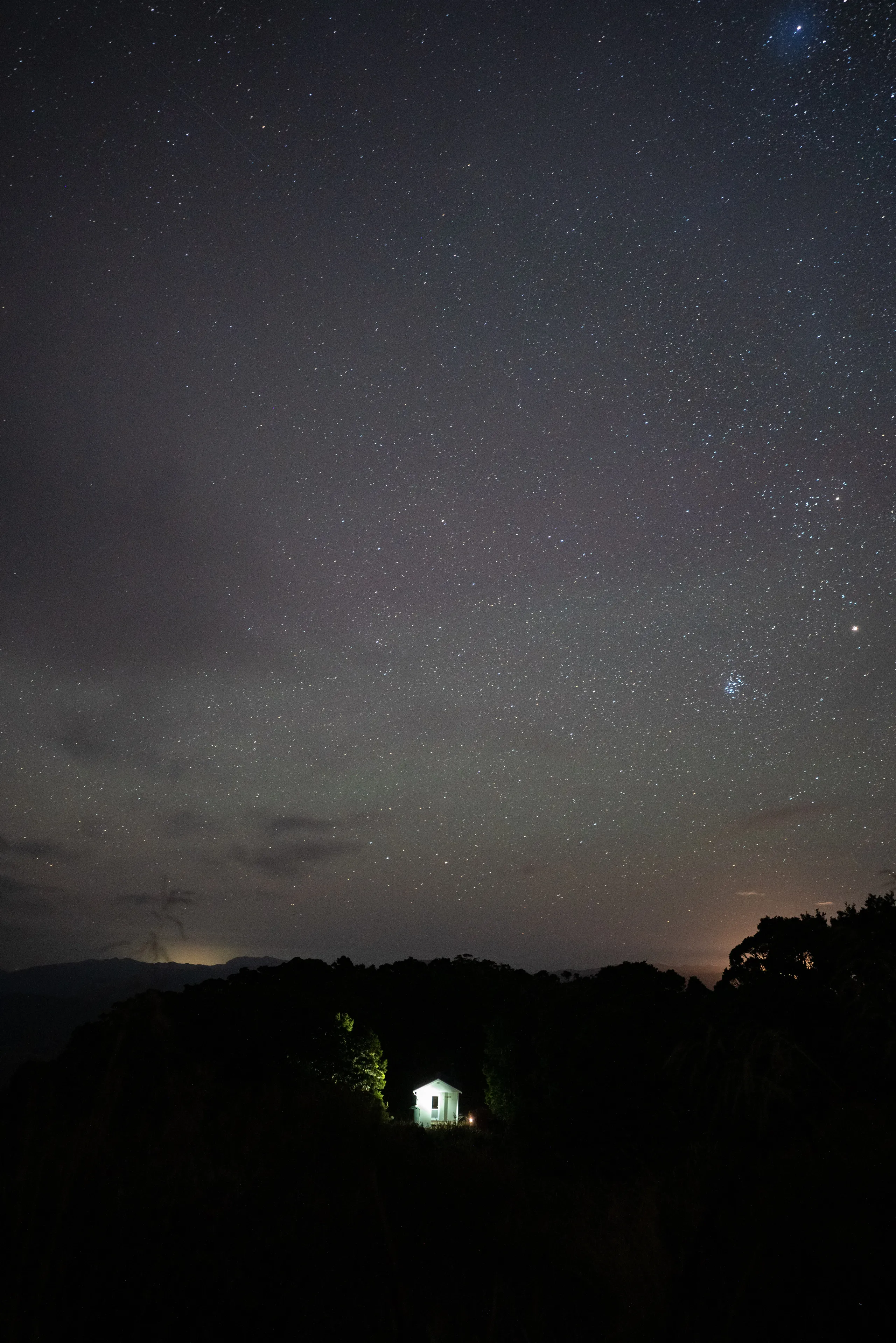 The hut at night with light pollution visible from Westport