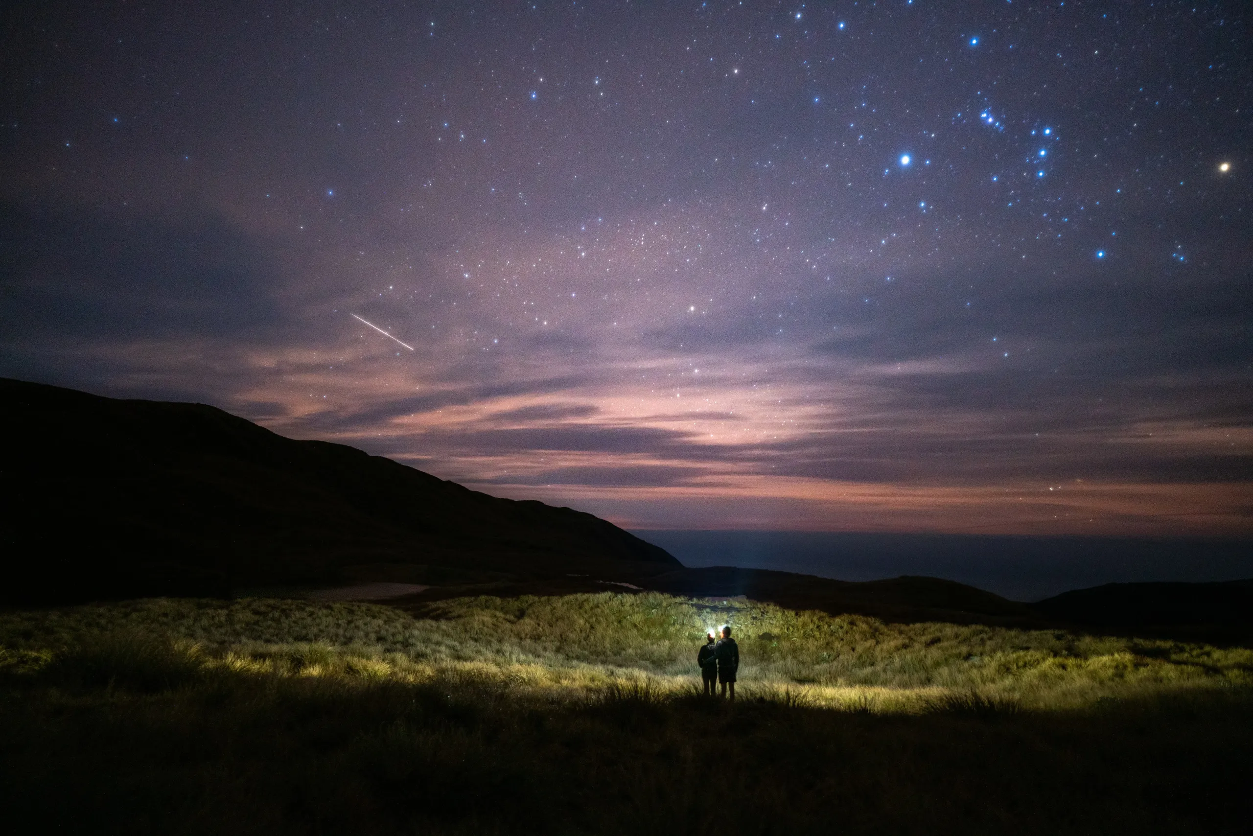 Watching shooting stars in the dying light of dusk