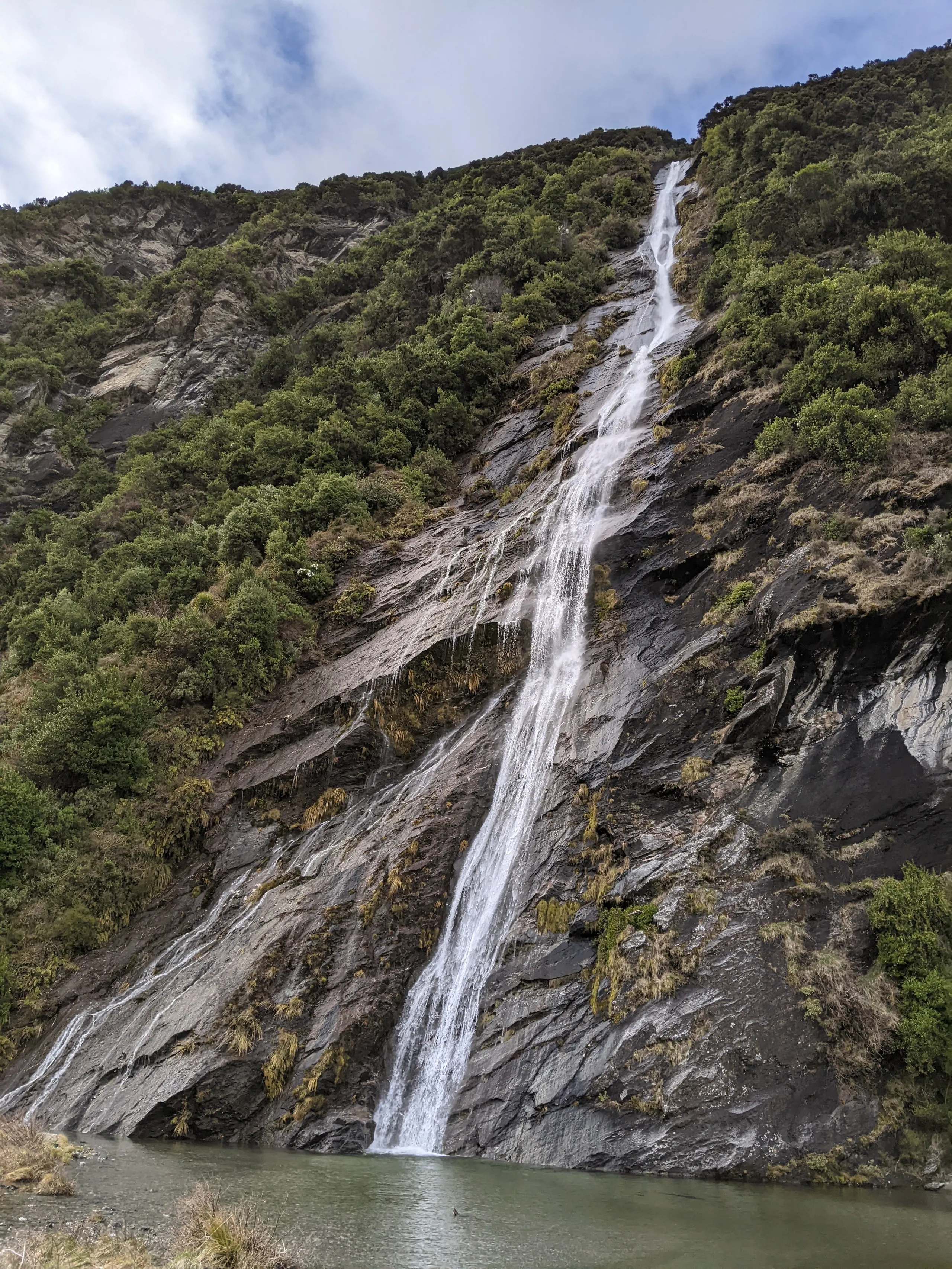 Beautiful 146m waterfall cascading down the cliffs opposite the hut. The basin at the base forms a delightful swimming hole.